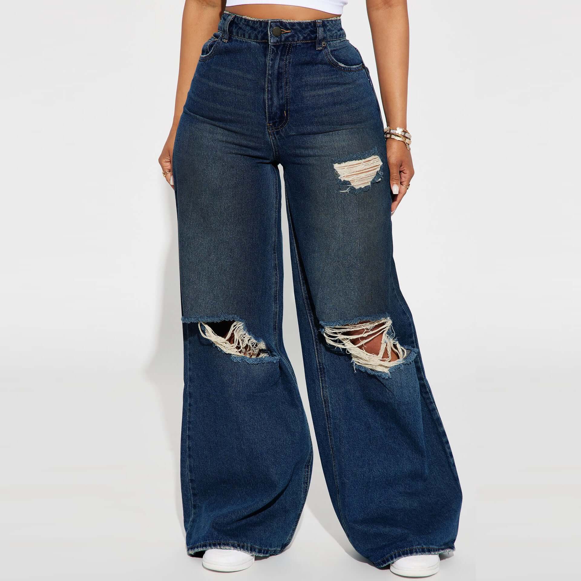 jeans de pierna ancha para mujer en color azul oscuro con detalles rasgados